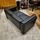 Two-seater sofa in black leather, designed by Tito Agnoli for Poltrona Frau, Italy, 1980s