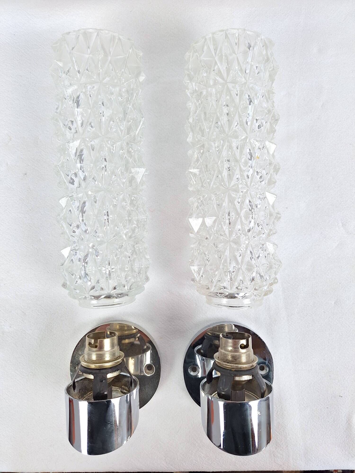 Pair of vintage Art Deco space age chrome and molded glass wall sconces