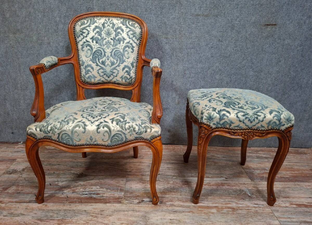 Cabriolet armchair in cherry wood with its footrest, 20th century.