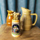 Two pitchers and a small original king beer mug
