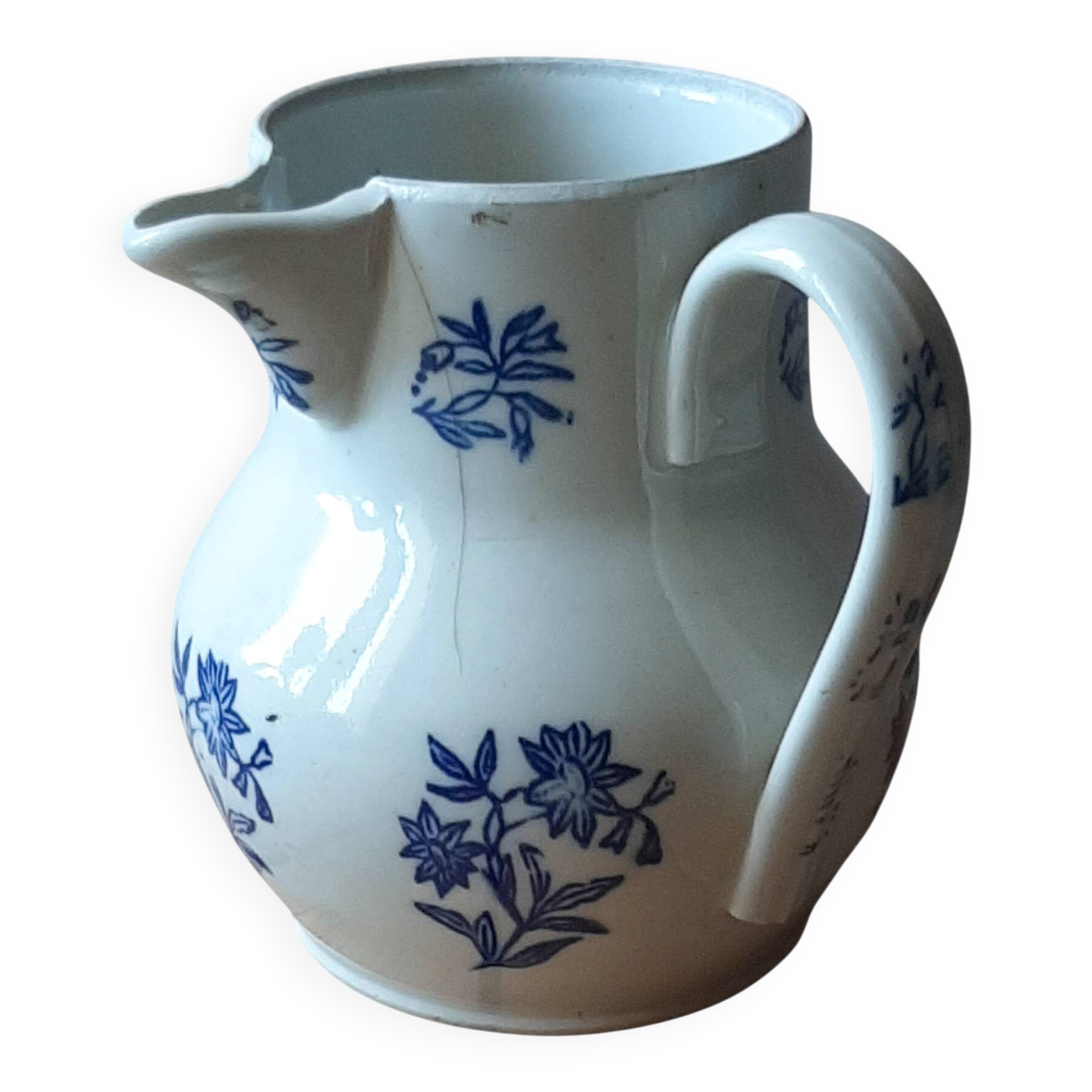 Large antique cruet in Saint Uze earthenware with blue flowers.