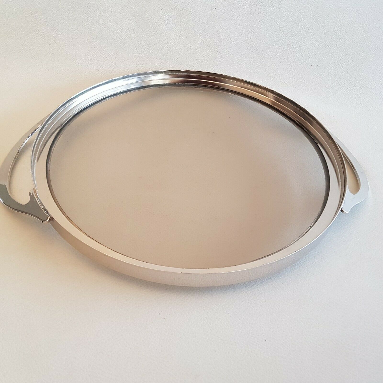 Round glass and art deco silver metal tray