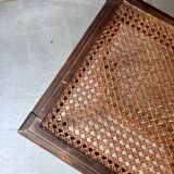 Stool, small wooden piano bench with carved details and caning.
