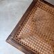 Stool, small wooden piano bench with carved details and caning.