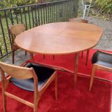 Roundtable with extension cords and chairs from the 1960s
