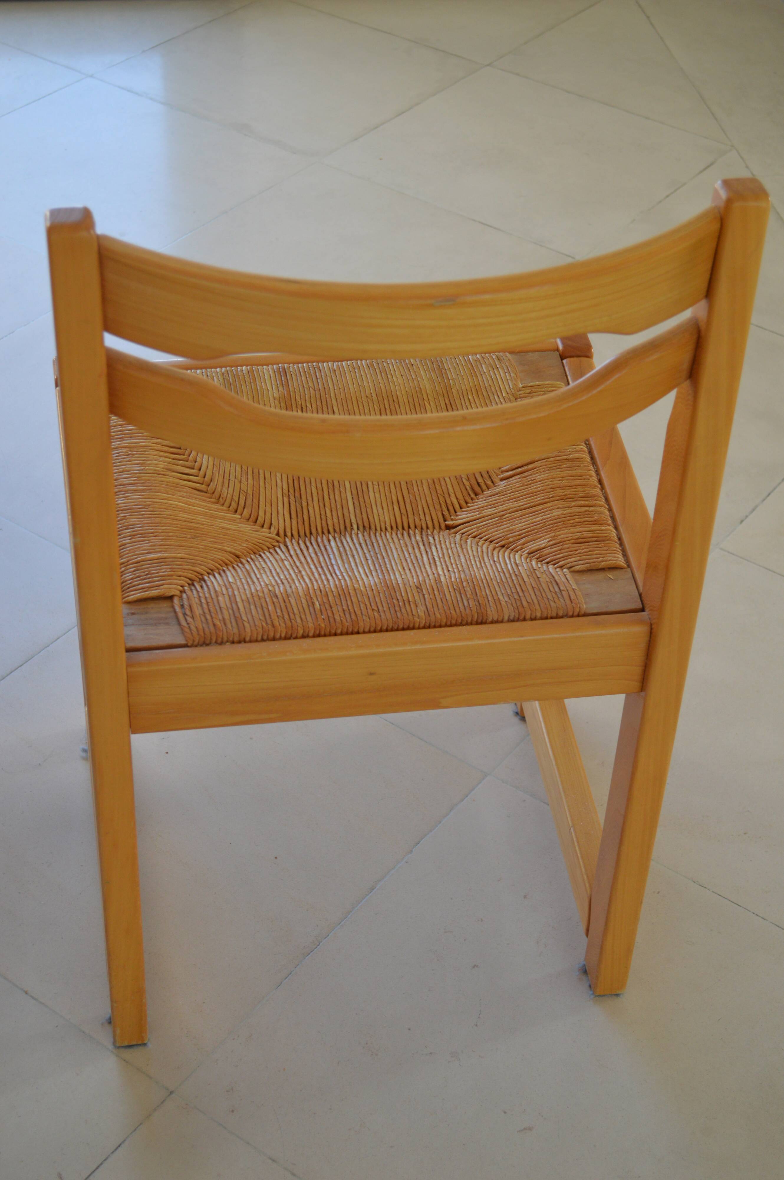 Chair made of solid elm, with a straw seat.