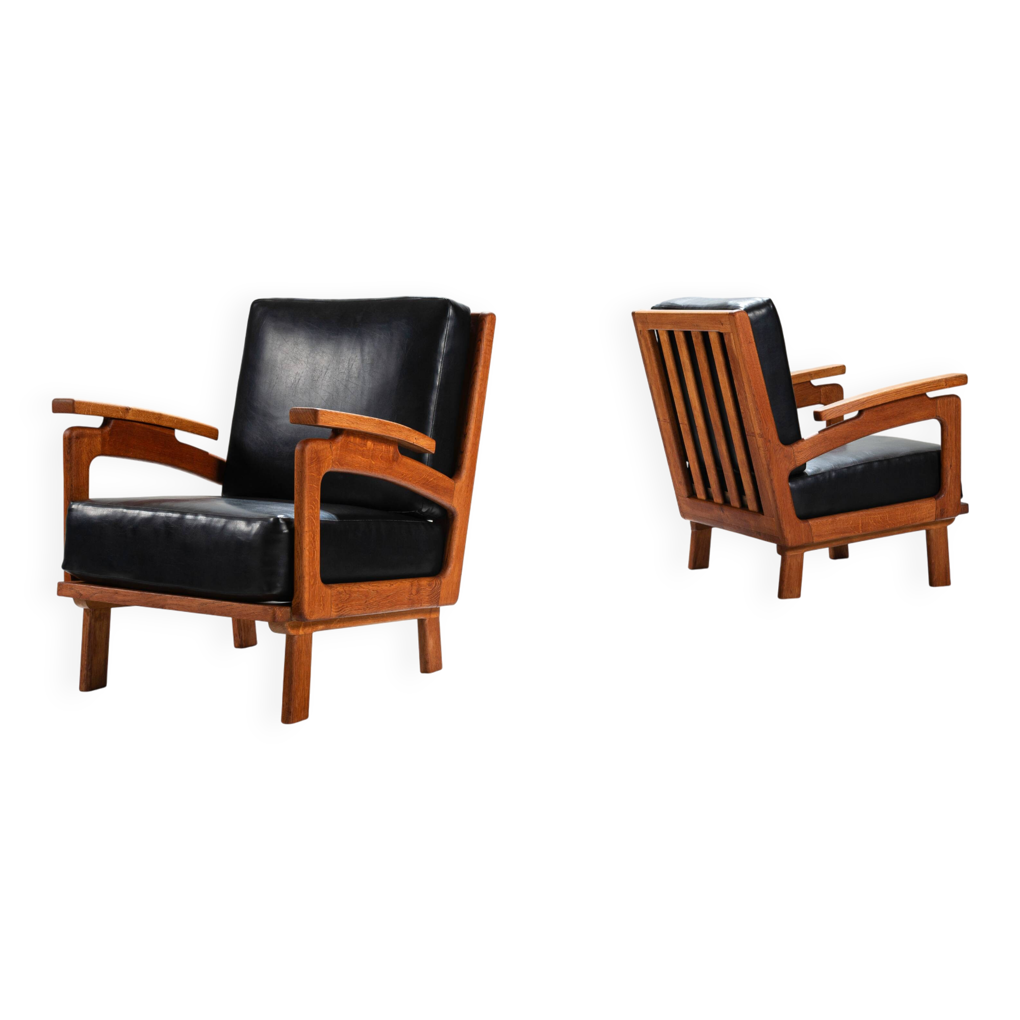 Pair of Belgian lounge chairs in solid oak with leather cushions