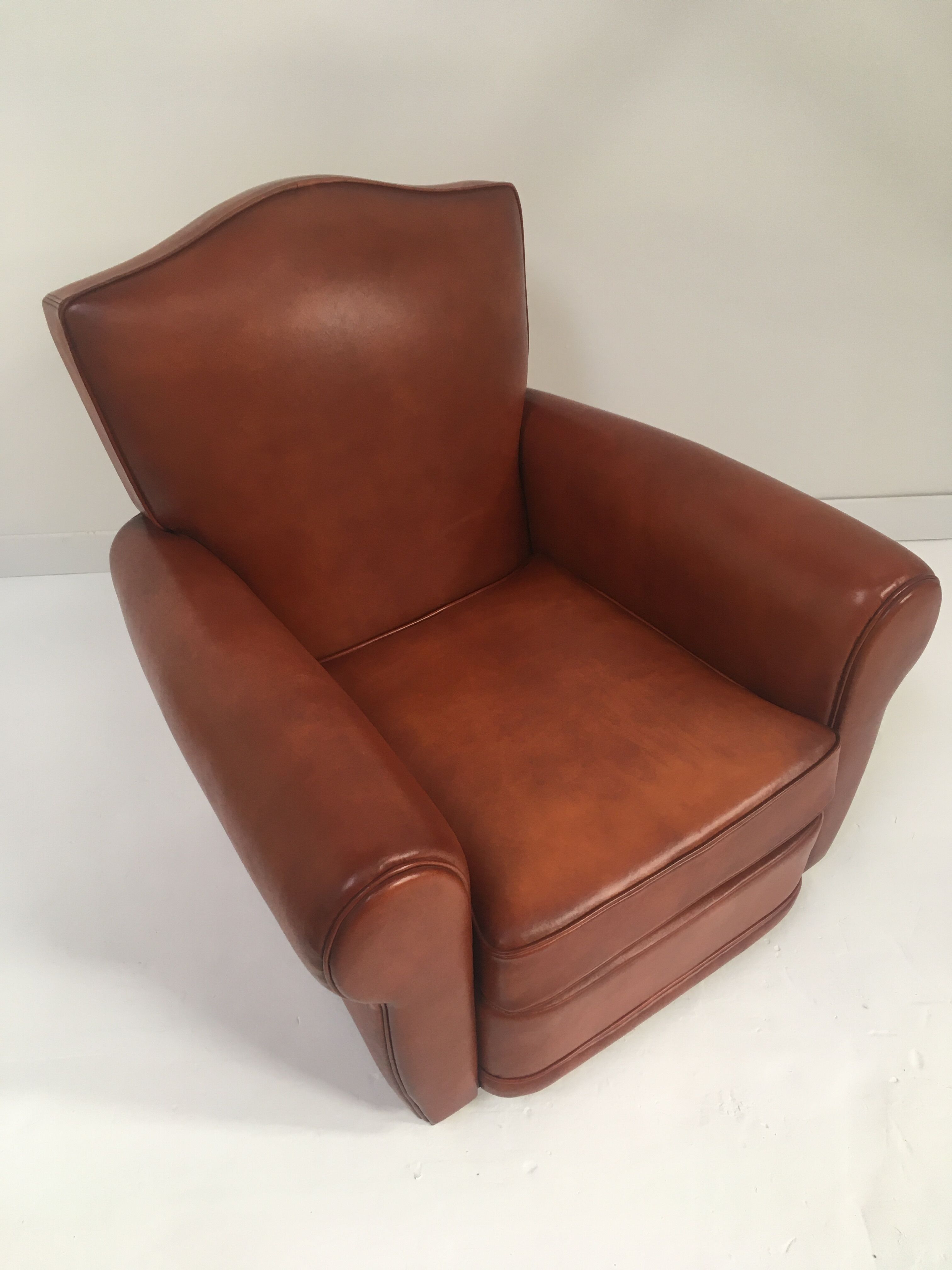 Large club chair in cognac leather