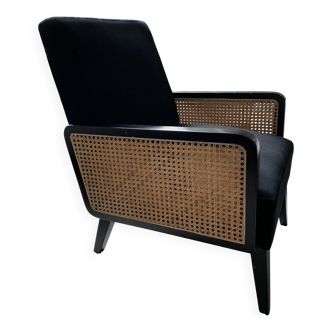 Fauteuil en velours noir et cannage
