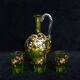 Small carafe and green glass drop glasses with rococo golden emailed decor