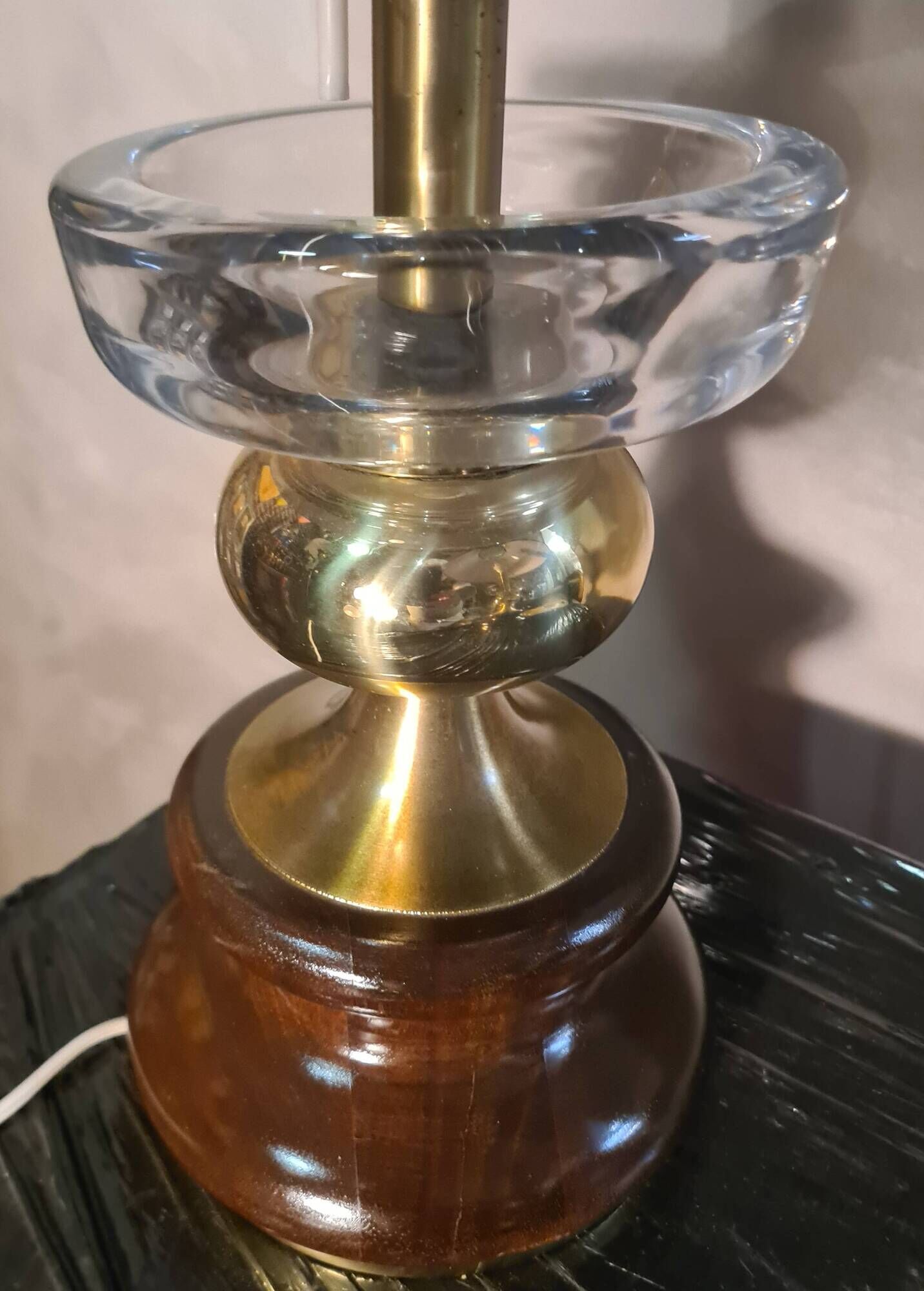 A pair of vintage table lamps featuring a turned wooden base, accessories...