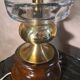 A pair of vintage table lamps featuring a turned wooden base, accessories...