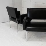 Pair of stainless steel, black leather-like armchairs, France, circa 1970