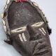 Tribal Dan mask in wood and cowrie shells, West Africa, 27 cm