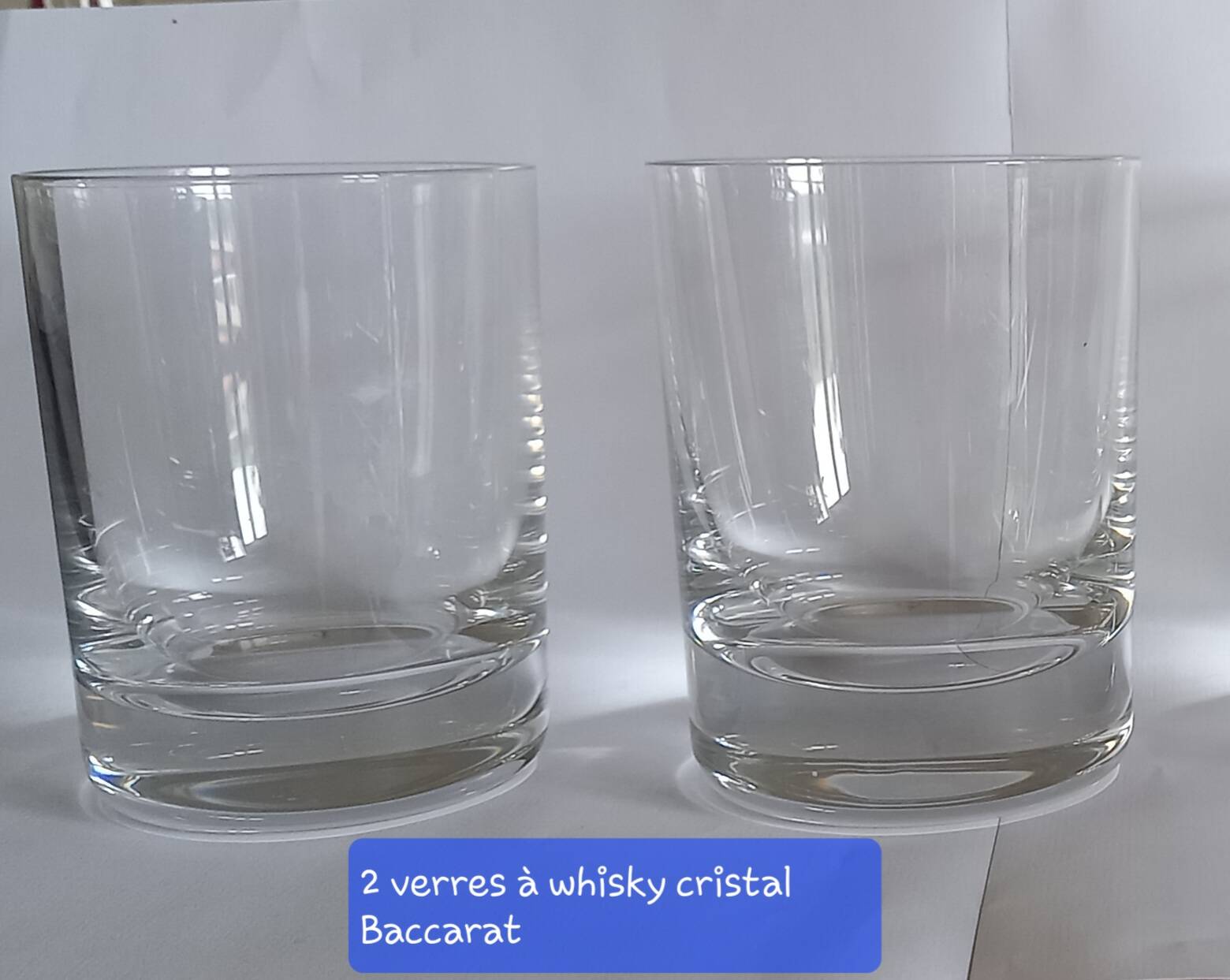 2 whisky glasses and a Baccarat crystal ashtray with stamps.