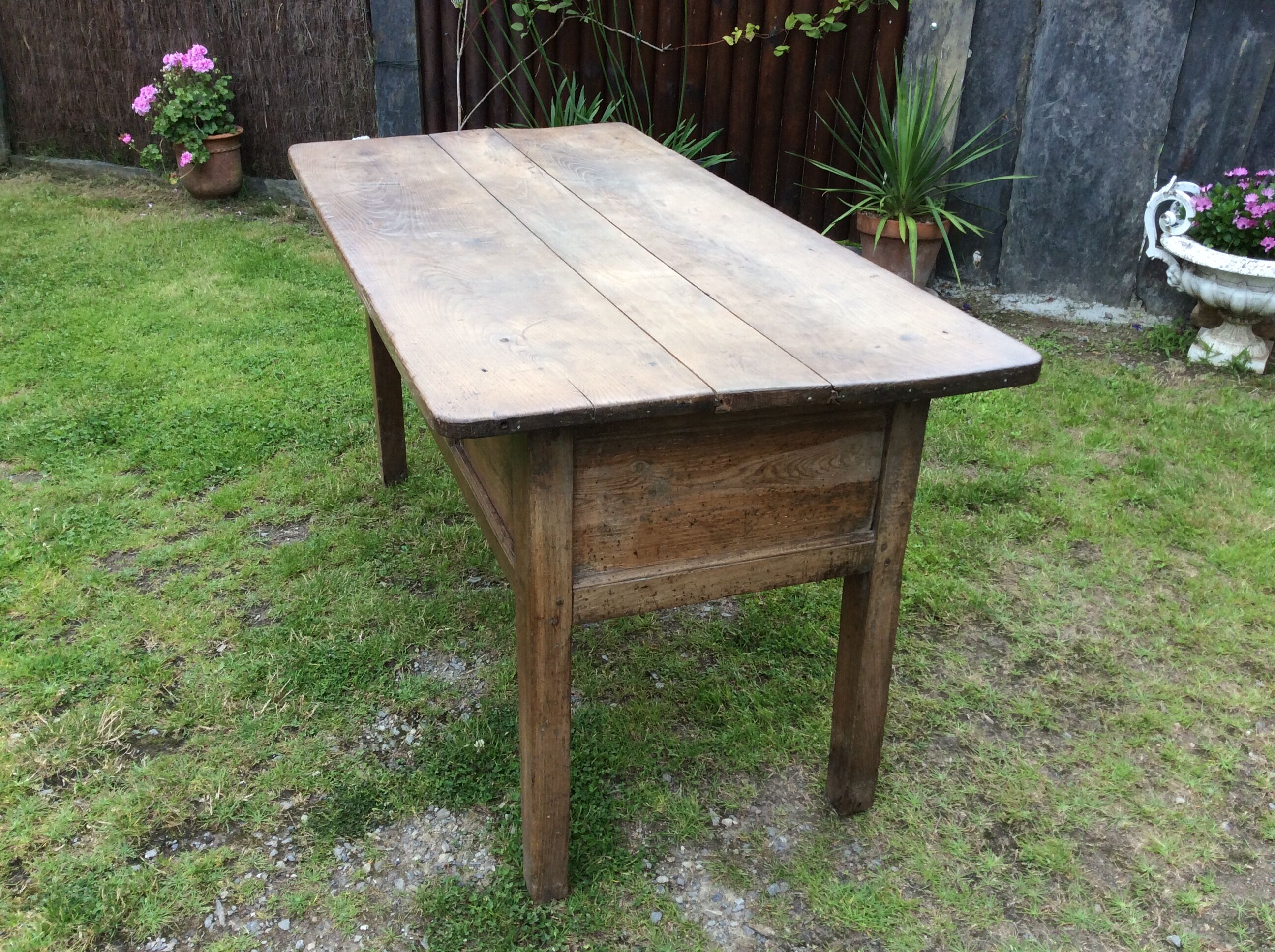 Farm table with panels with oak spindle feet. (said dairy table)