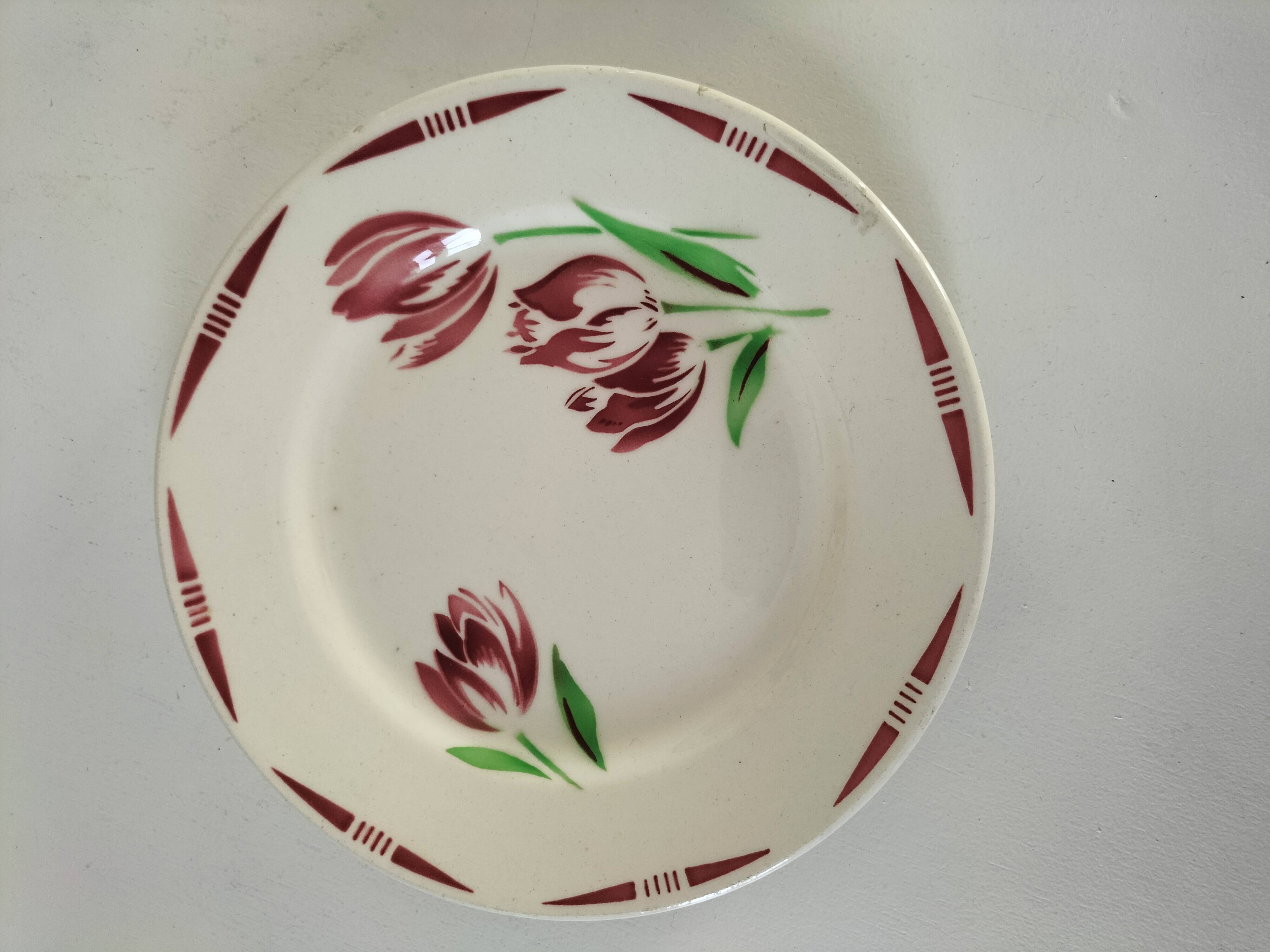 Set of 8 ironstone plates with coordinated designs.