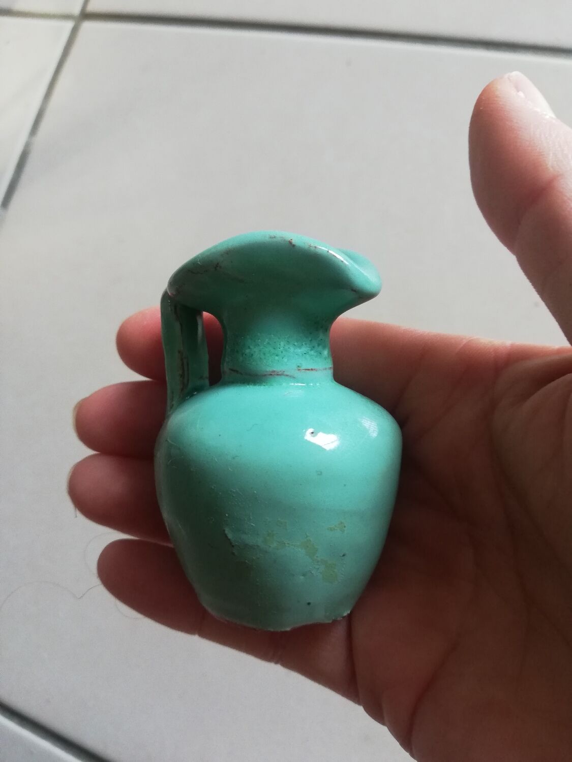 Very small turquoise soliflore in the shape of a ceramic jug