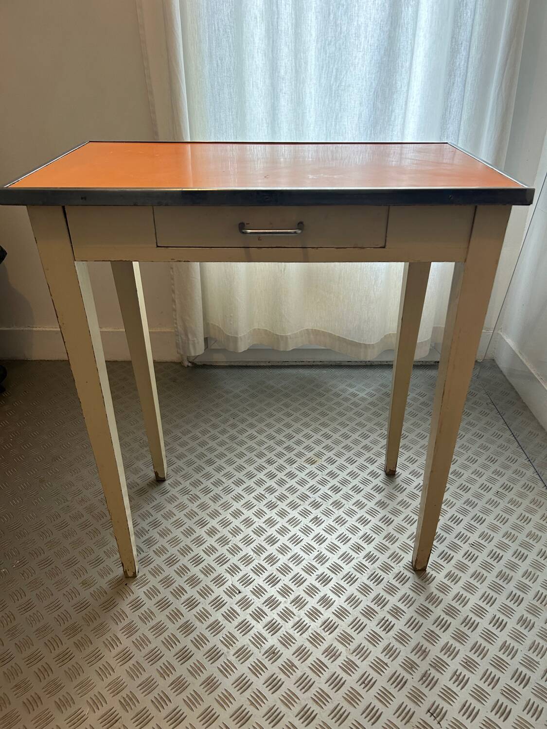 Orange wood and formica table