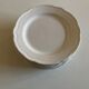 Set of 7 Mougins plates in white enamelled clay with gadroons