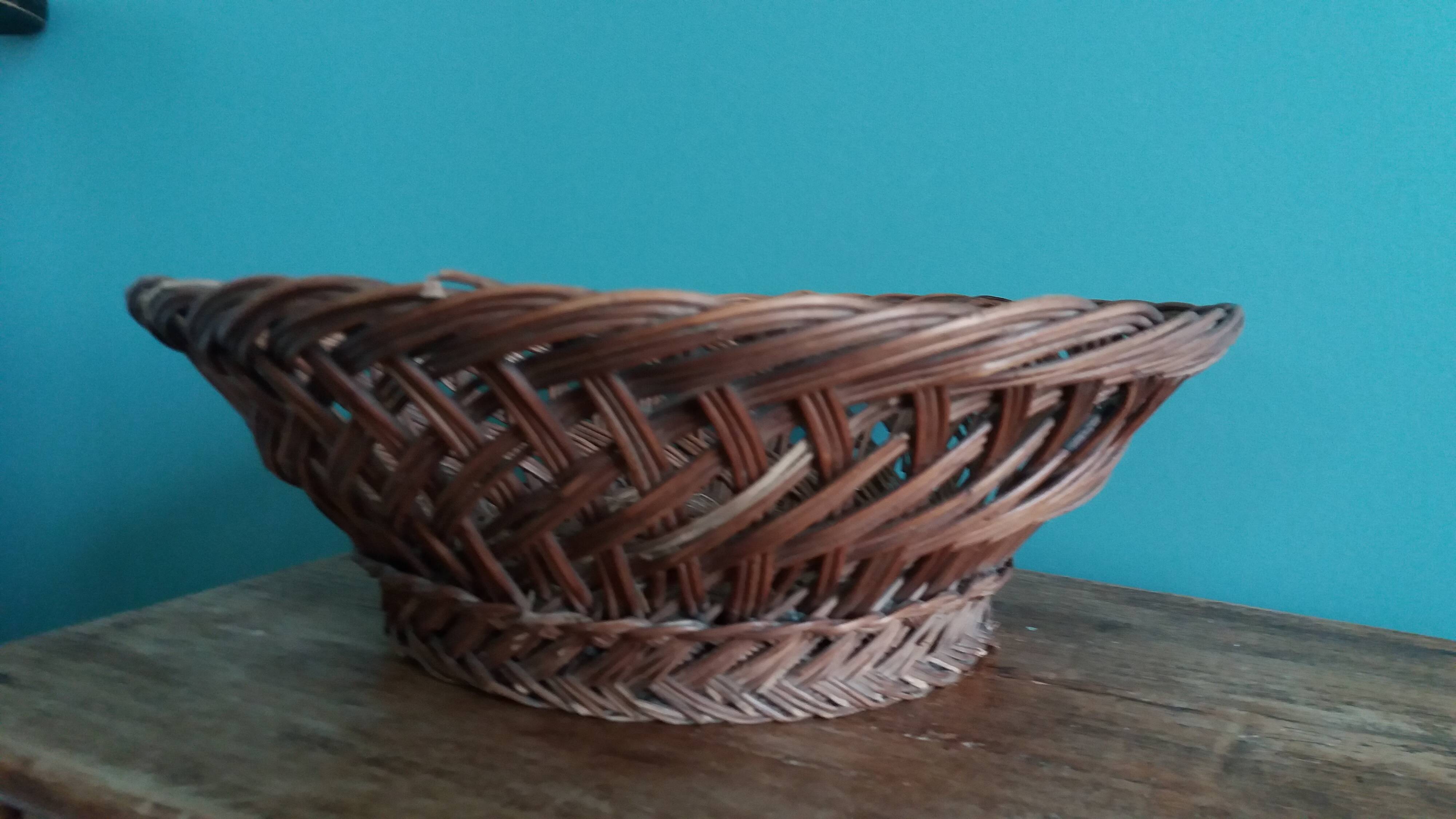 Antique basket, fruit basket or bread basket made of wicker