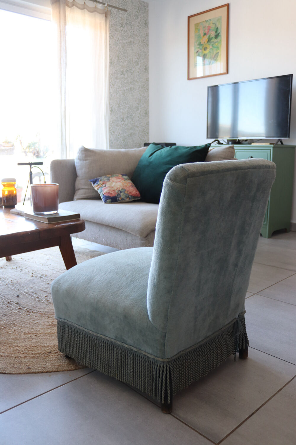 Vintage blue velvet fringed armchair.