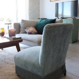 Vintage blue velvet fringed armchair.