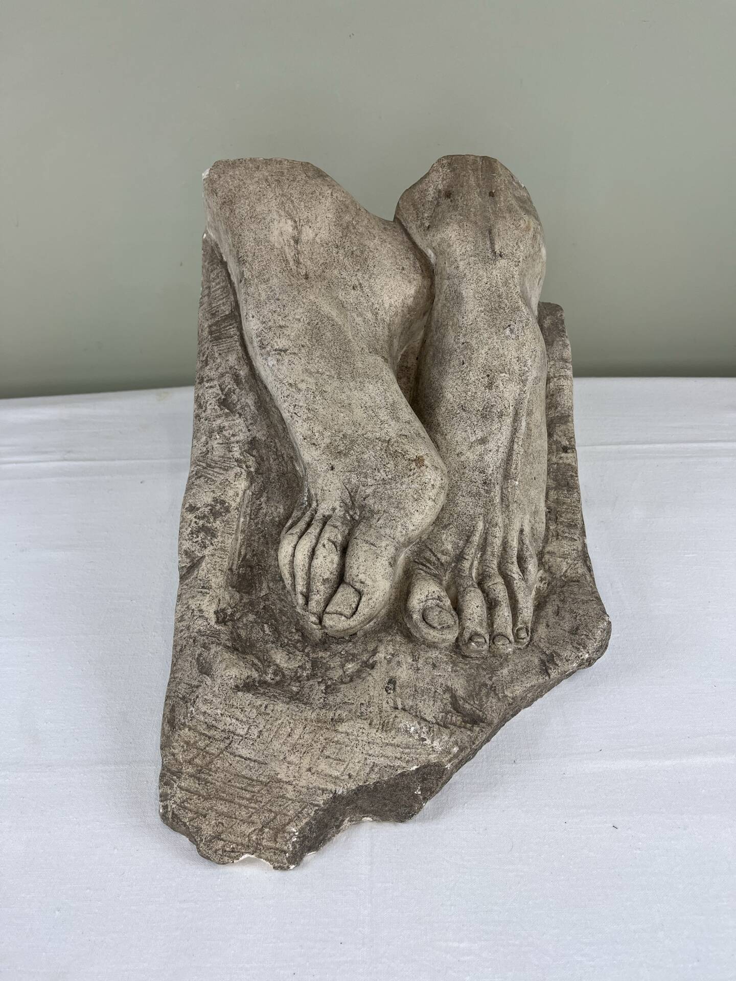 Stone sculpture, two feet on a block, signed D. Paillot.