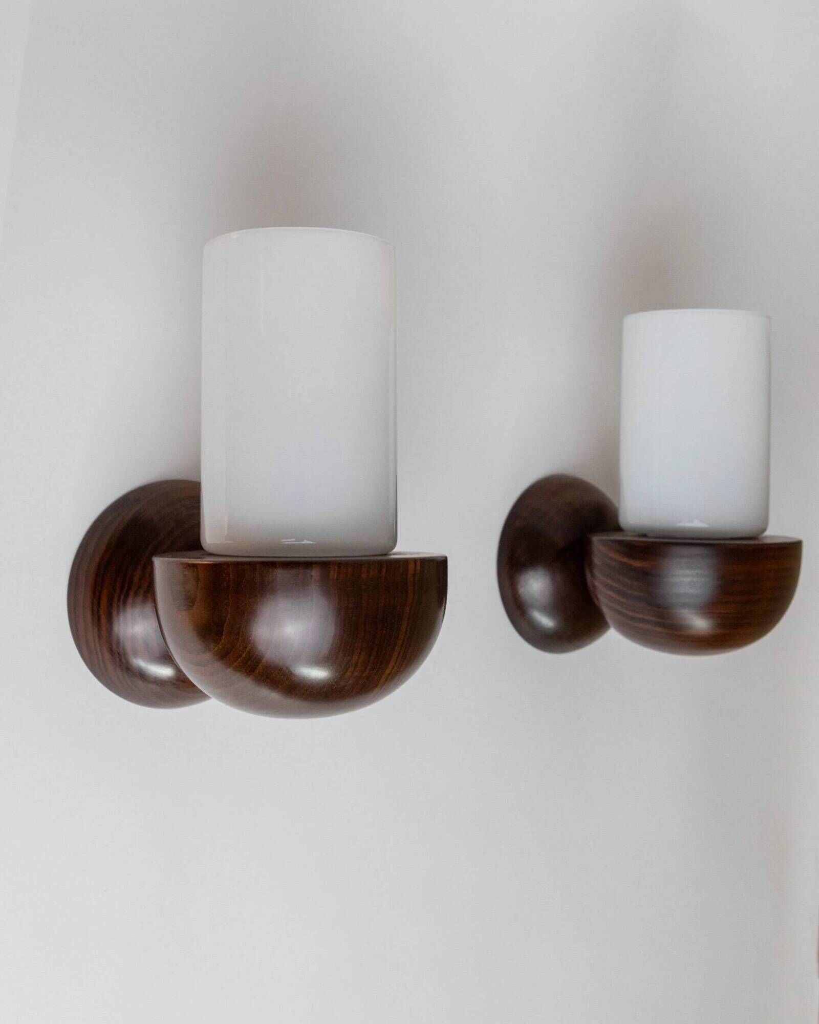 Vintage wall sconces from the 1960s, set of 2, dark wood with white glass shades, Mid-Century Modern lighting, sculptural wall sconces.
