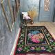 Tapis en laine vintage avec un design floral dans des couleurs douces