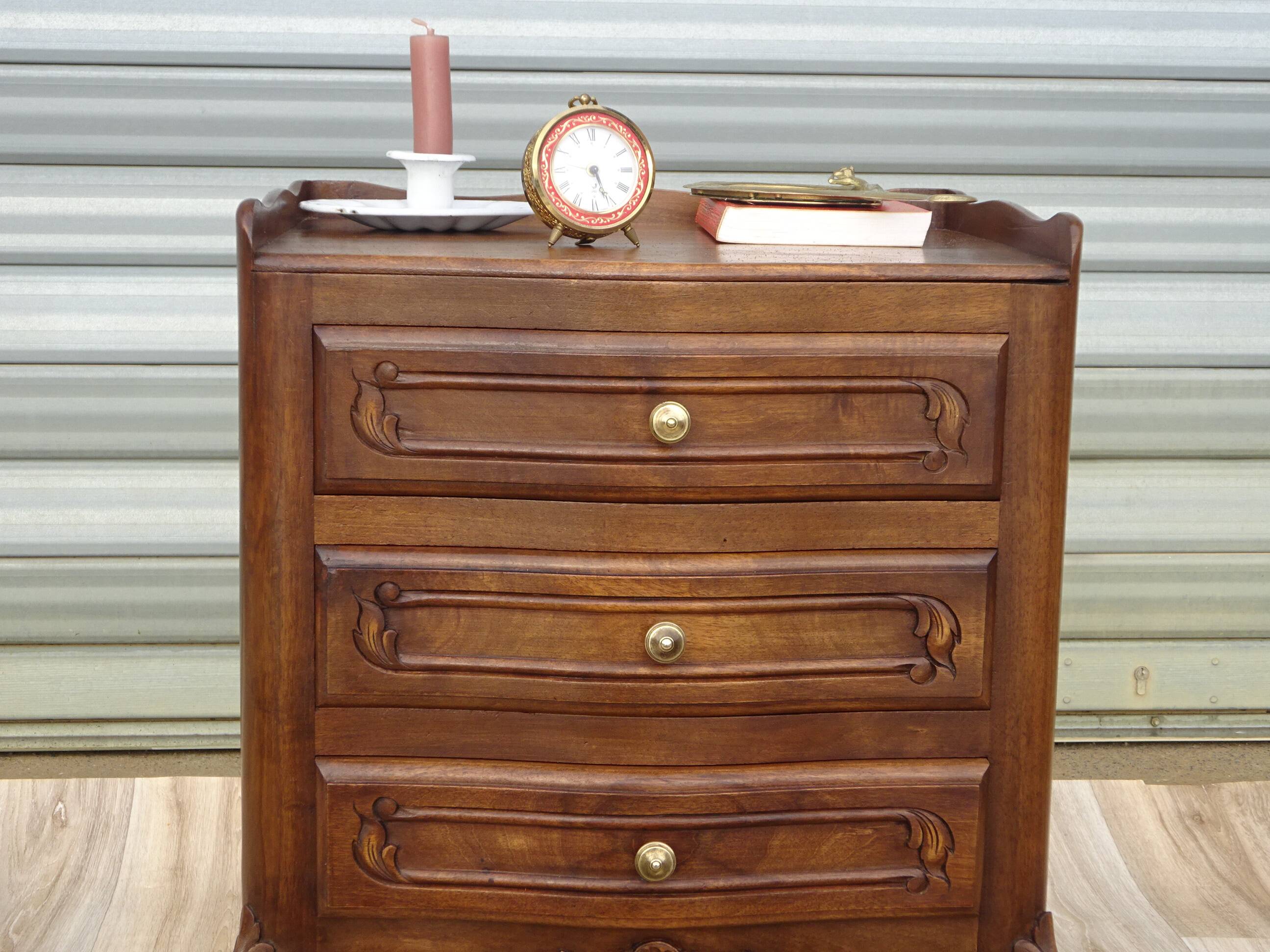 Louis XV bedside table in walnut, 3 drawers, raised edges on the tops.