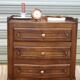 Louis XV bedside table in walnut, 3 drawers, raised edges on the tops.