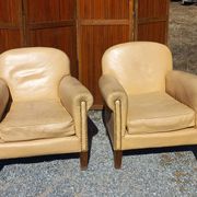 Pair of 1930s club armchairs in ivory leather.