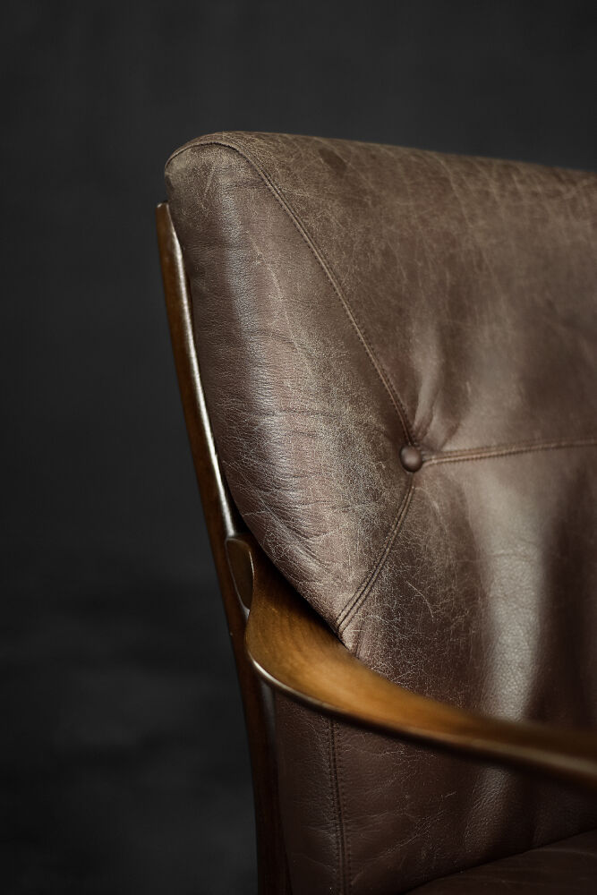 Modern vintage Danish armchair in beech and brown leather by Farstrup Møbler, 1970.