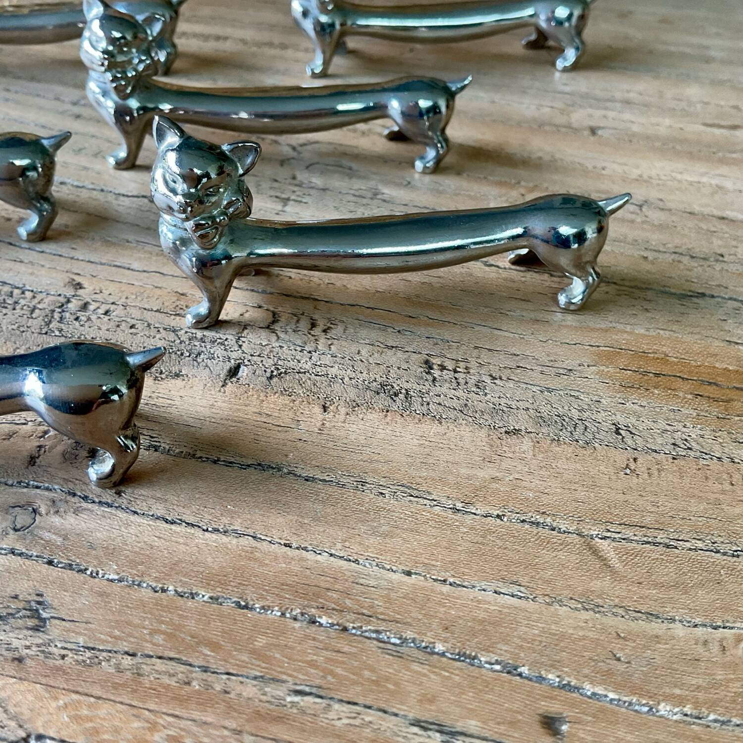 6 silver metal “cat” knife holders