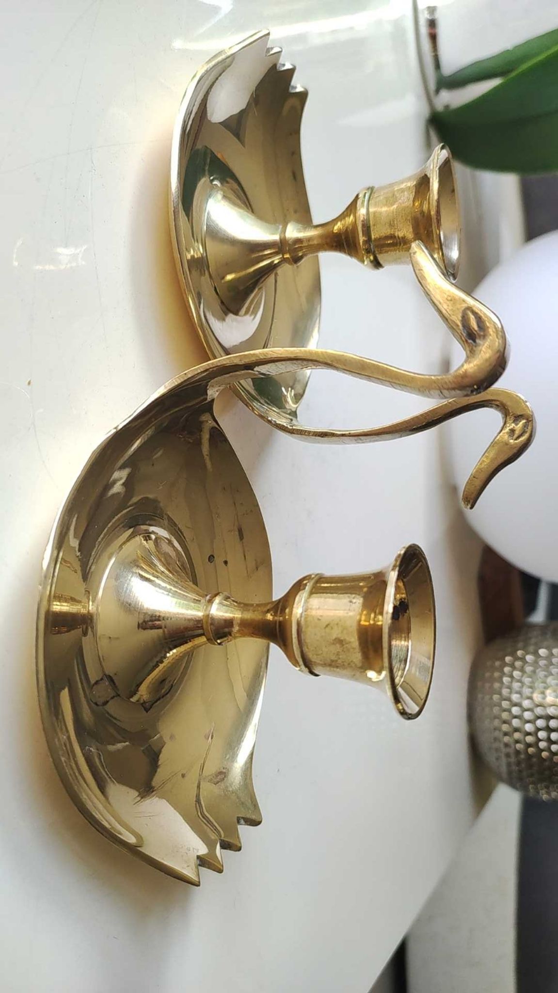Pair of hand candle holders/Cellar rats shape swans, in polished brass. 1950s