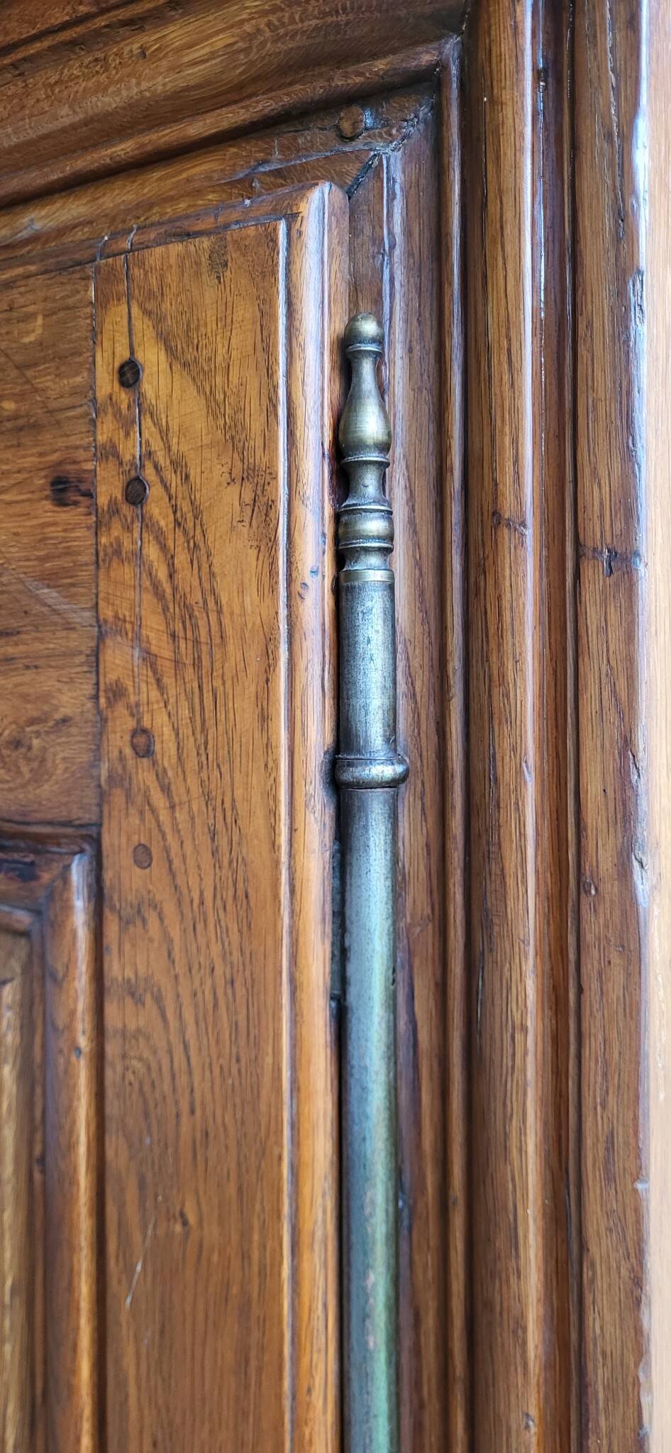 Louis XIII oak wardrobe, bonnetière, 18th century.