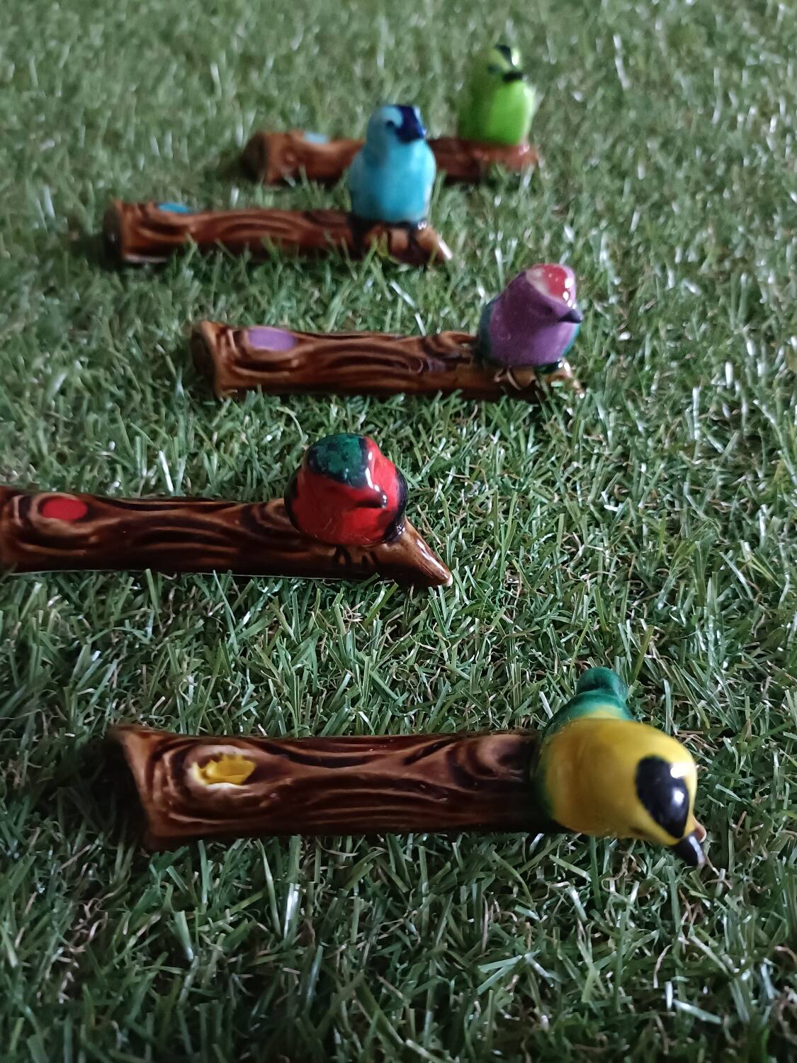 Set of six barbotine bird knife rests