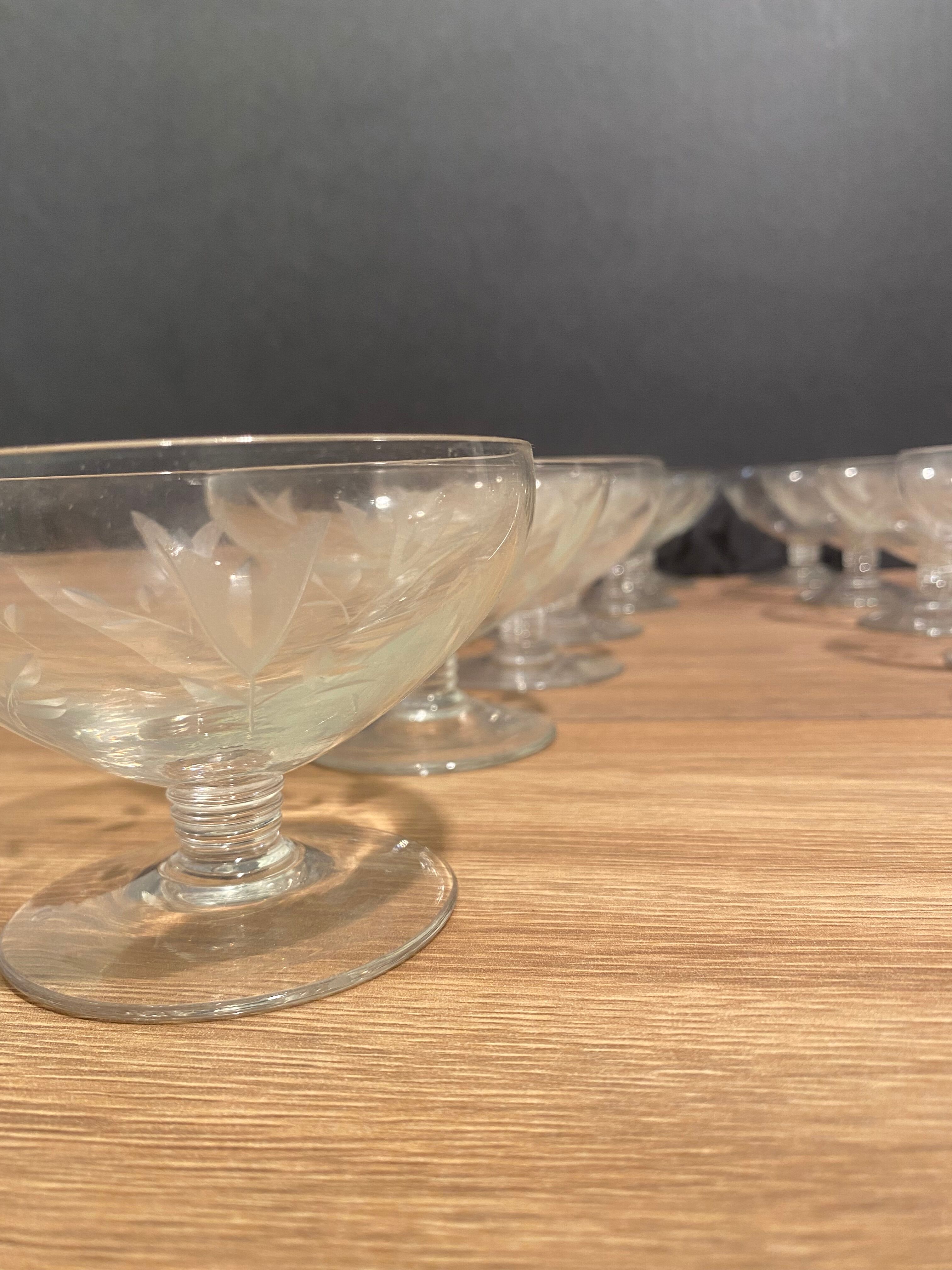 Suite of 12 champagne glasses in cut glass with floral decoration