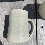 Set in stoneware cups and pitcher