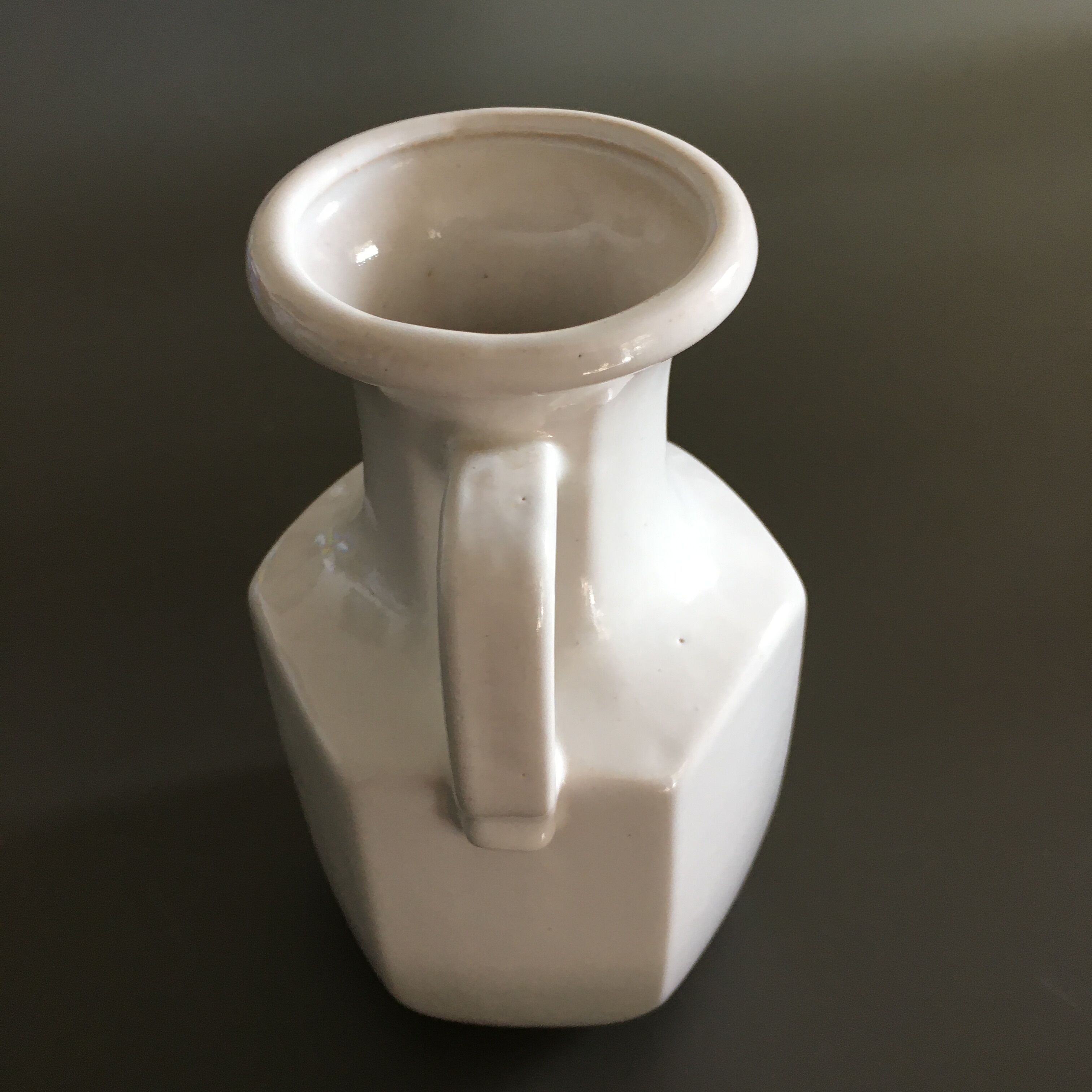 Ivory vase with handle