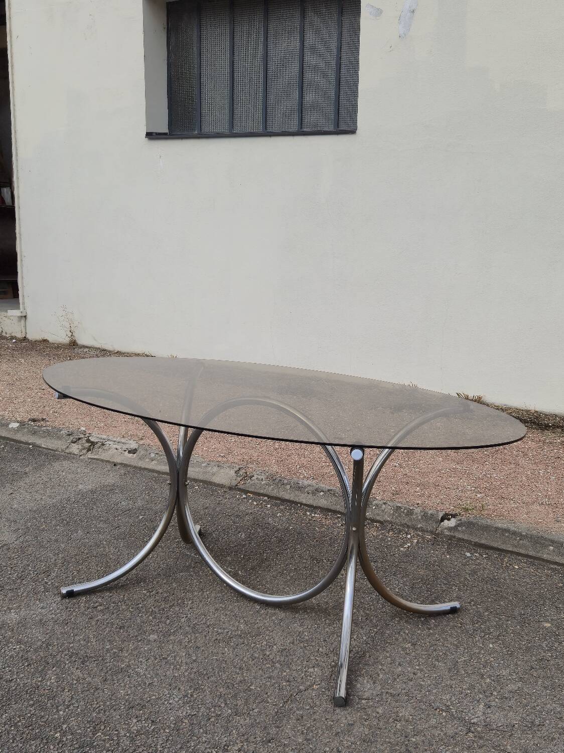 Vintage oval design table in smoked glass and chrome legs