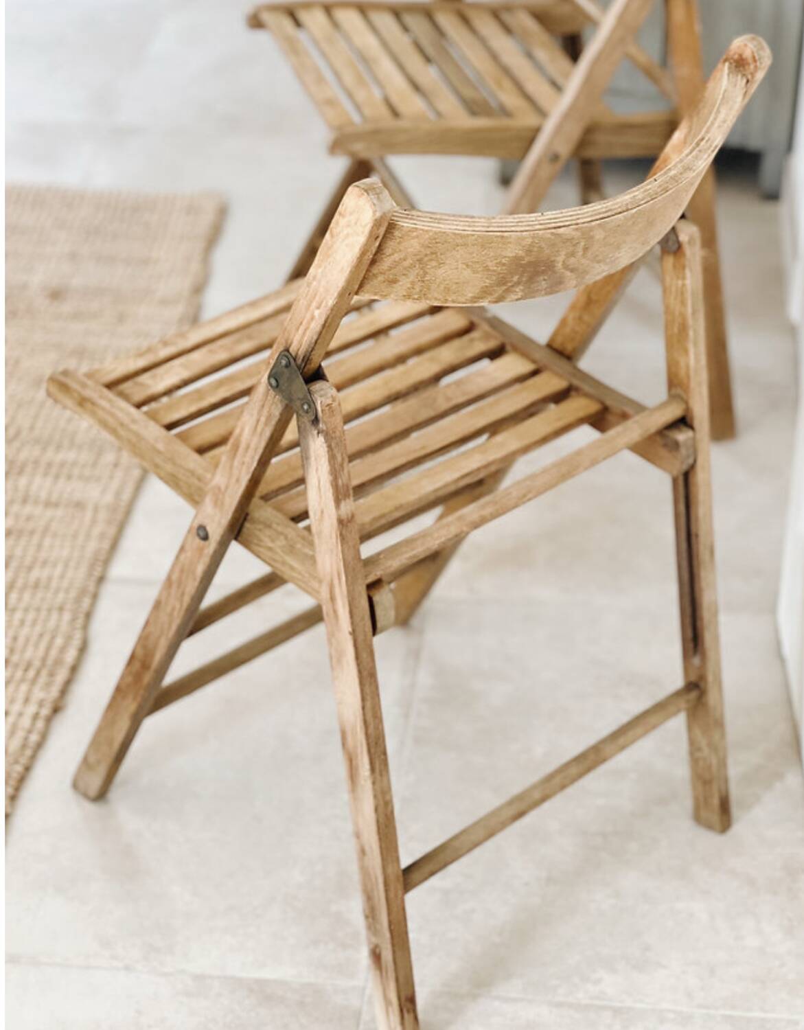 Pair of folding wooden chairs