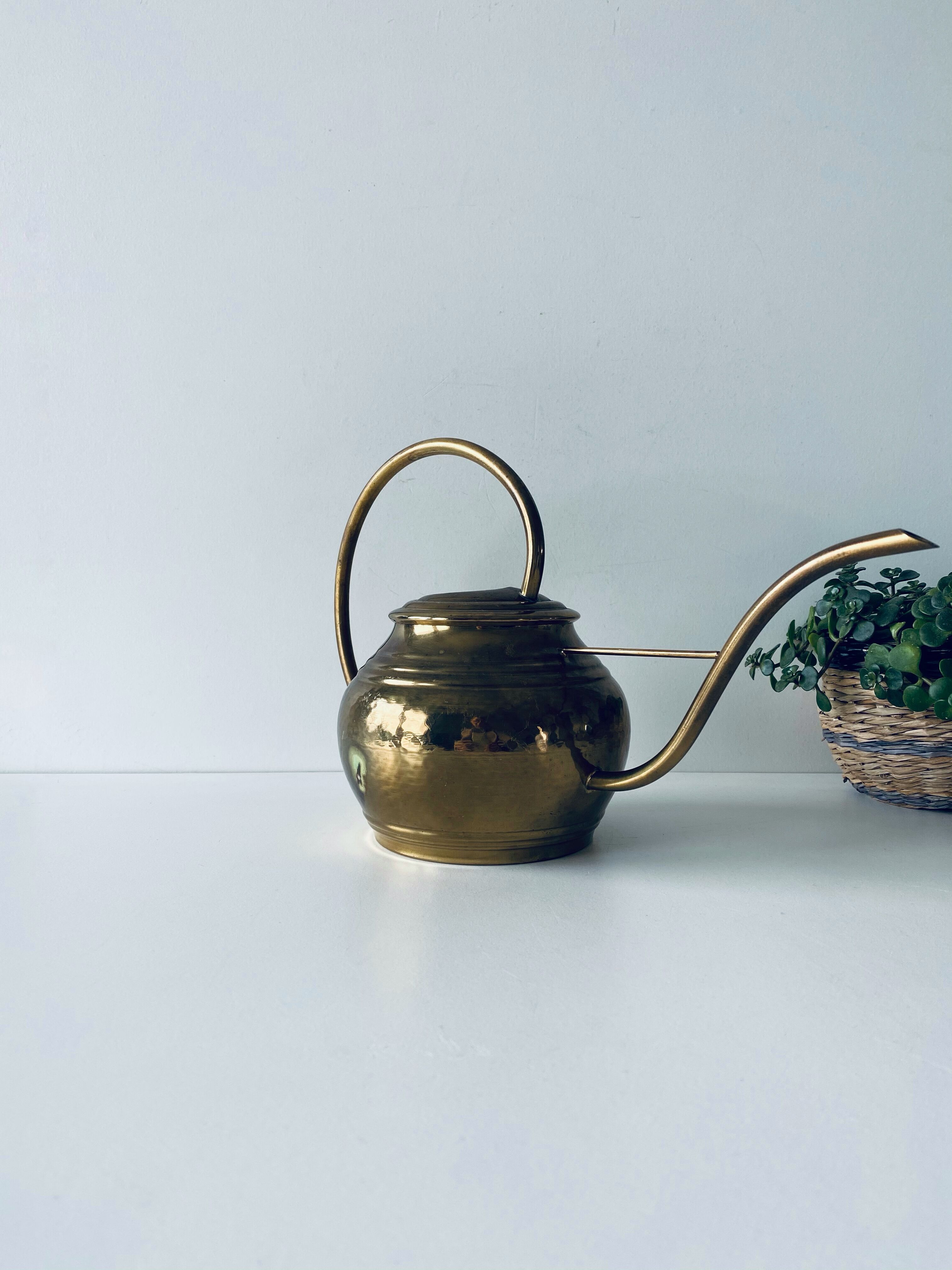 Old brass watering can