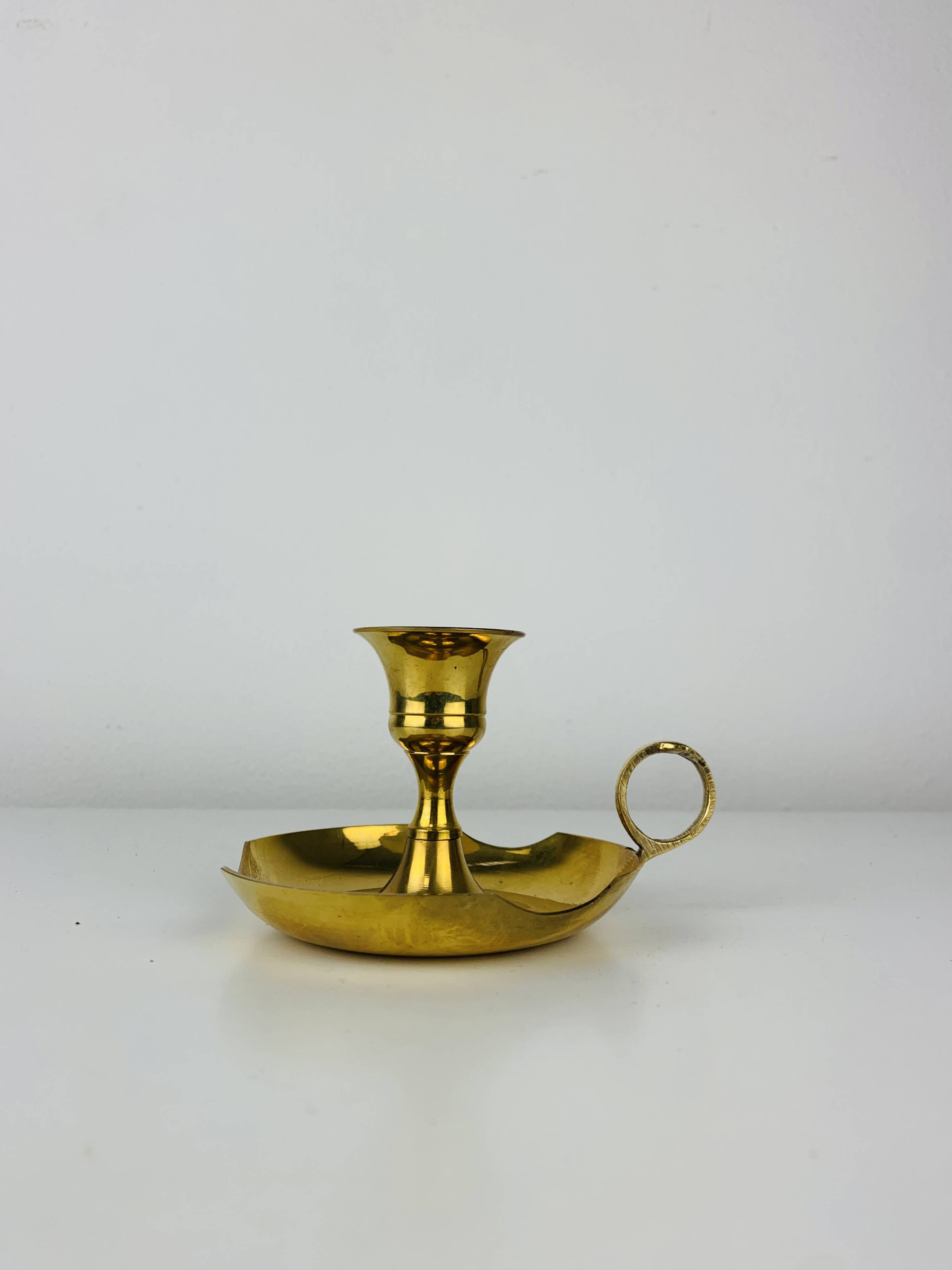 Golden brass candlestick rat of the cellar