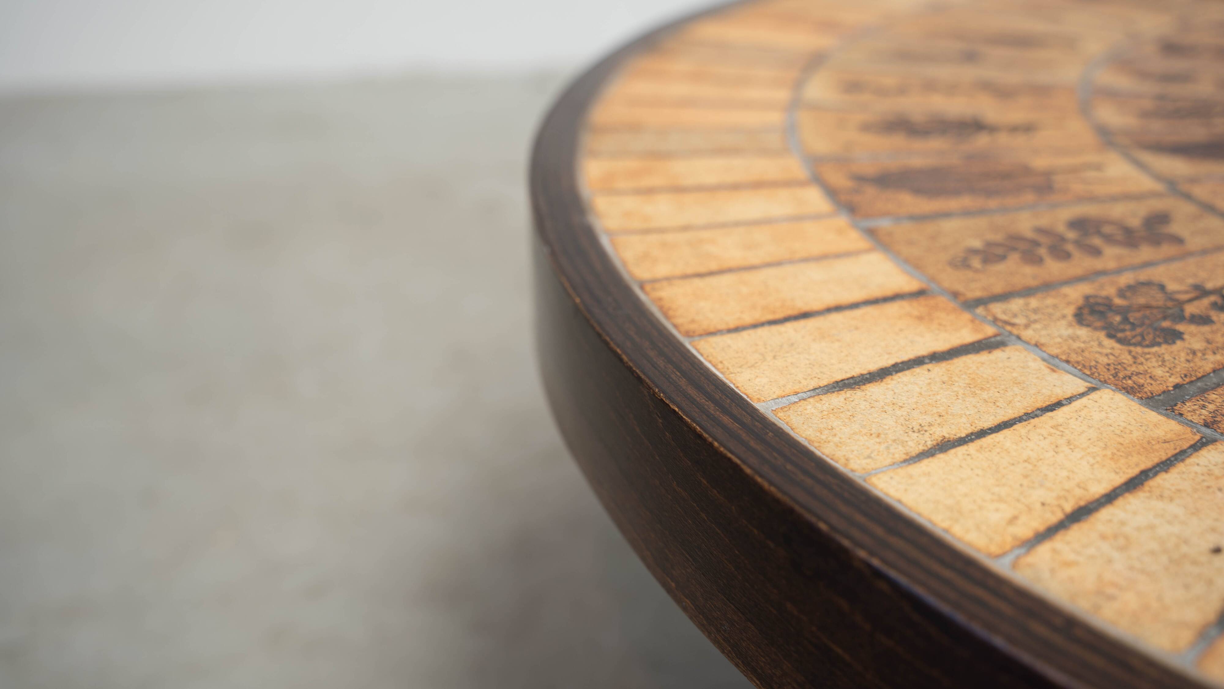 Round coffee table by Roger Capron