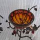 Pair of Art Deco style candle holders in wrought iron and amber blown glass.