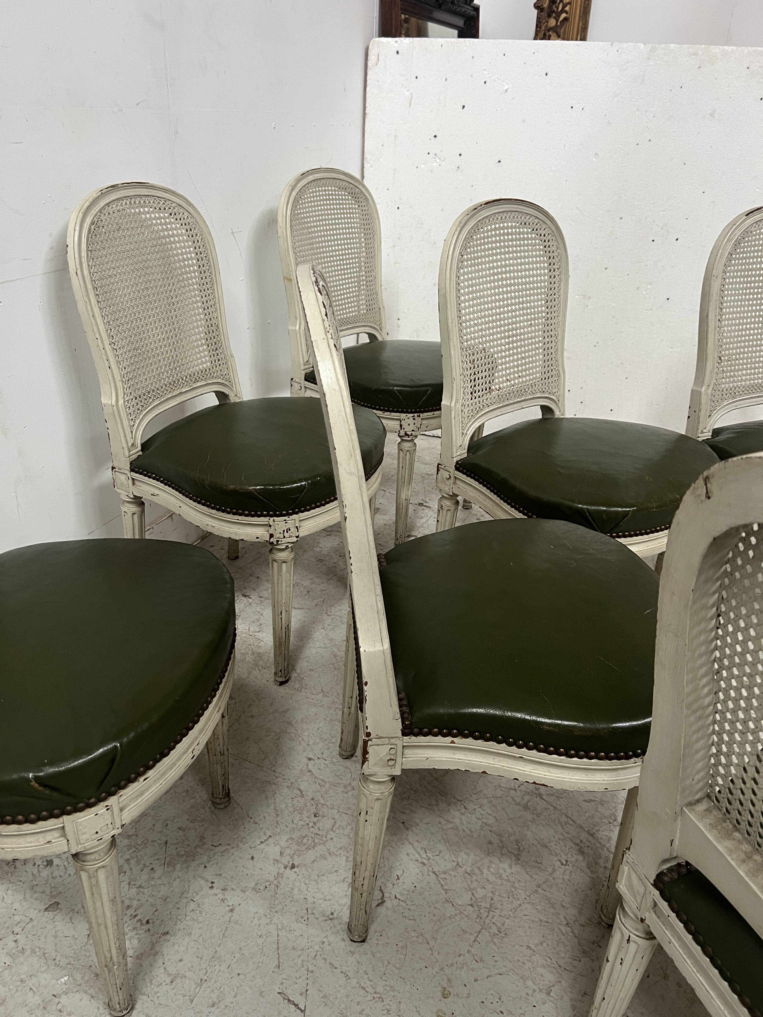 Set of seven Louis XVI style chairs in patinated beech, 20th century.