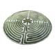 Circular rug with green decor on a cream background from the Labyrinth.