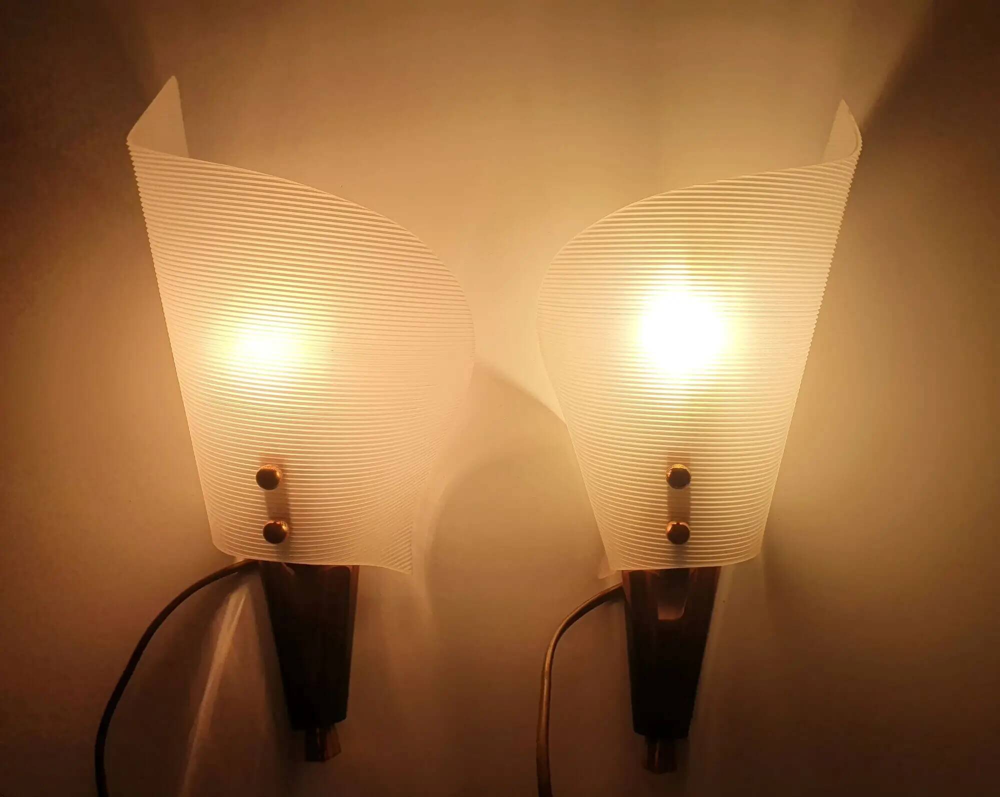 Pair of copper and plexiglass torch wall lights from the 1960s
